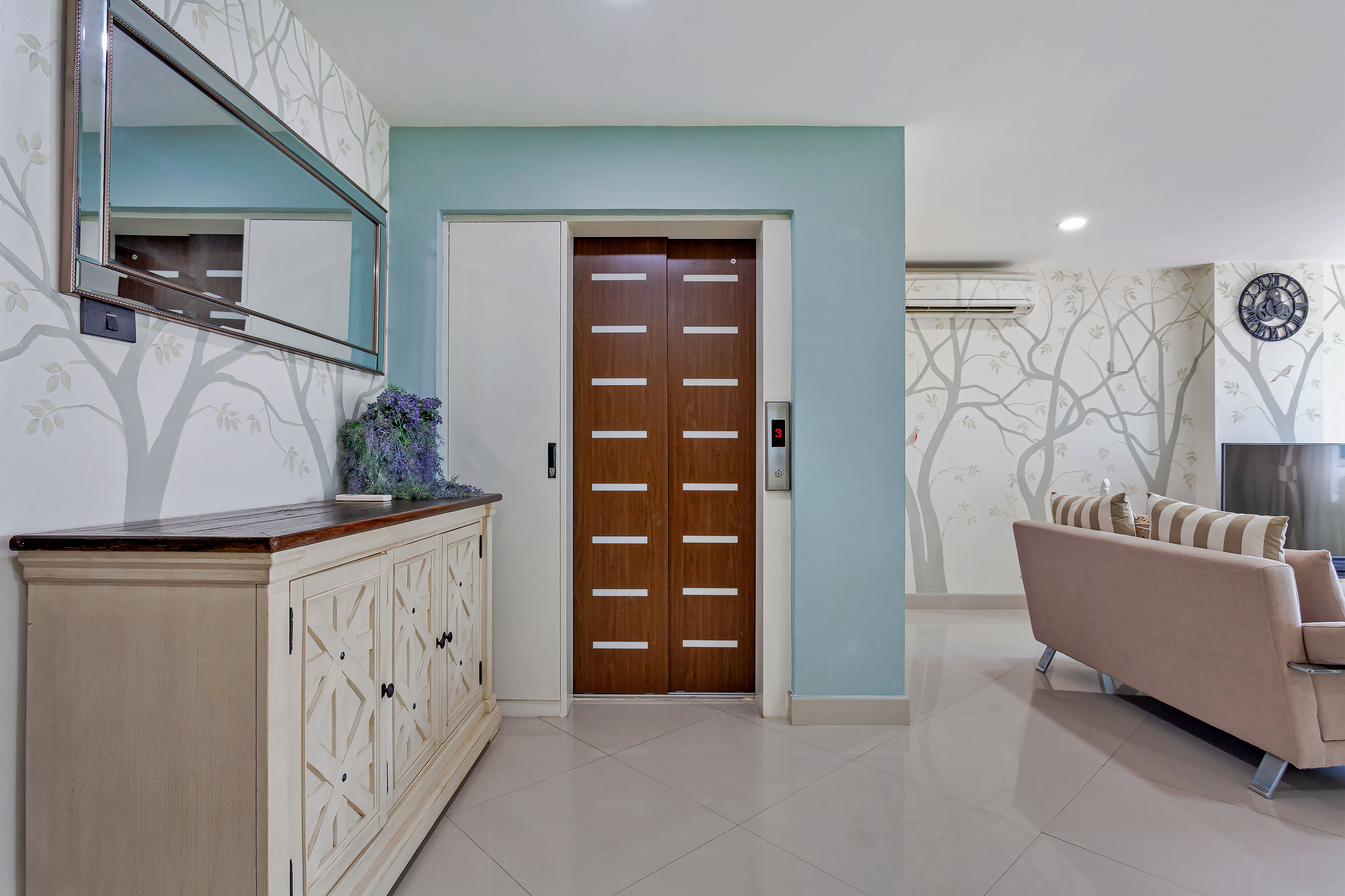 Private lift opening into the penthouse living room at Grosvenor House